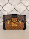 Louis Vuitton Monogram Reverse Trunk Clutch — Black Trim
